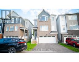Modern townhouse with brick facade and two-car garage - 352 Appalachian Circle Ottawa