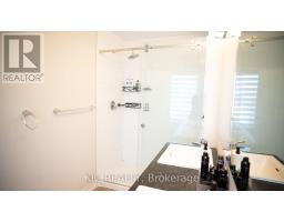 Modern bathroom with glass shower, dual sinks, and granite vanity - 352 Appalachian Circle Ottawa