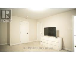 Bedroom with TV on dresser and white doors - 352 Appalachian Circle Ottawa