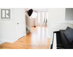 Hallway with digital piano and photography lights - 352 Appalachian Circle Ottawa