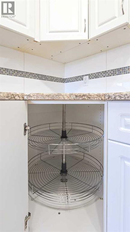Lower corner cabinet has a lazy susan for organized storage