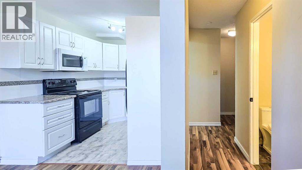 Main Floor Hallway to the 2 Piece Bathroom