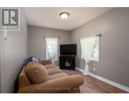 Living room with sectional sofa and TV - 2956 County Road 14 Stone Mills