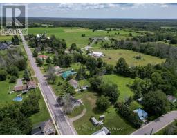 Rural property with homes, fields, and trees - 2956 County Road 14 Stone Mills