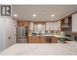 Living room - 10615 Elliott Street Unit# 106, Summerland, BC V0H1Z2 Photo 6