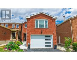 Red brick house with garage, porch, garden, and bay window - 109 Woodcroft Lane Vaughan