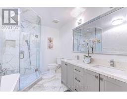 Modern bathroom with glass shower, soaking tub, and dual vanity - 109 Woodcroft Lane Vaughan