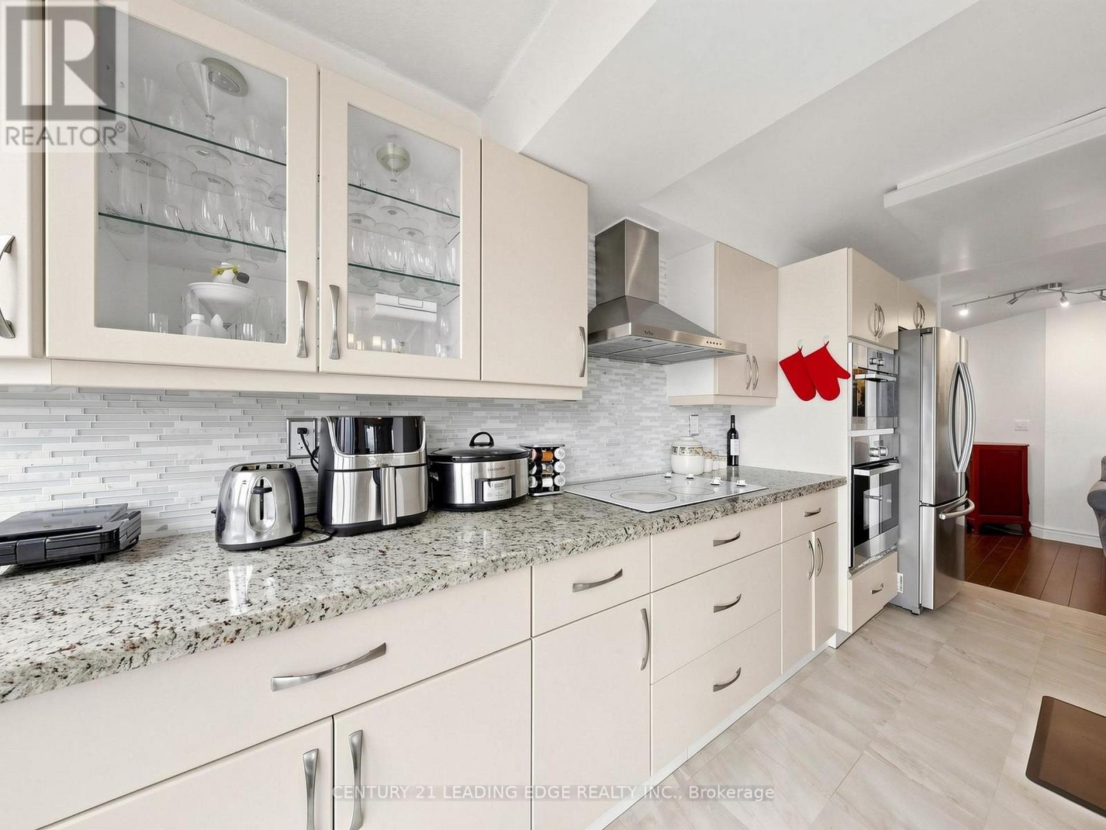 #204 3231 EGLINTON AVENUE E - 3