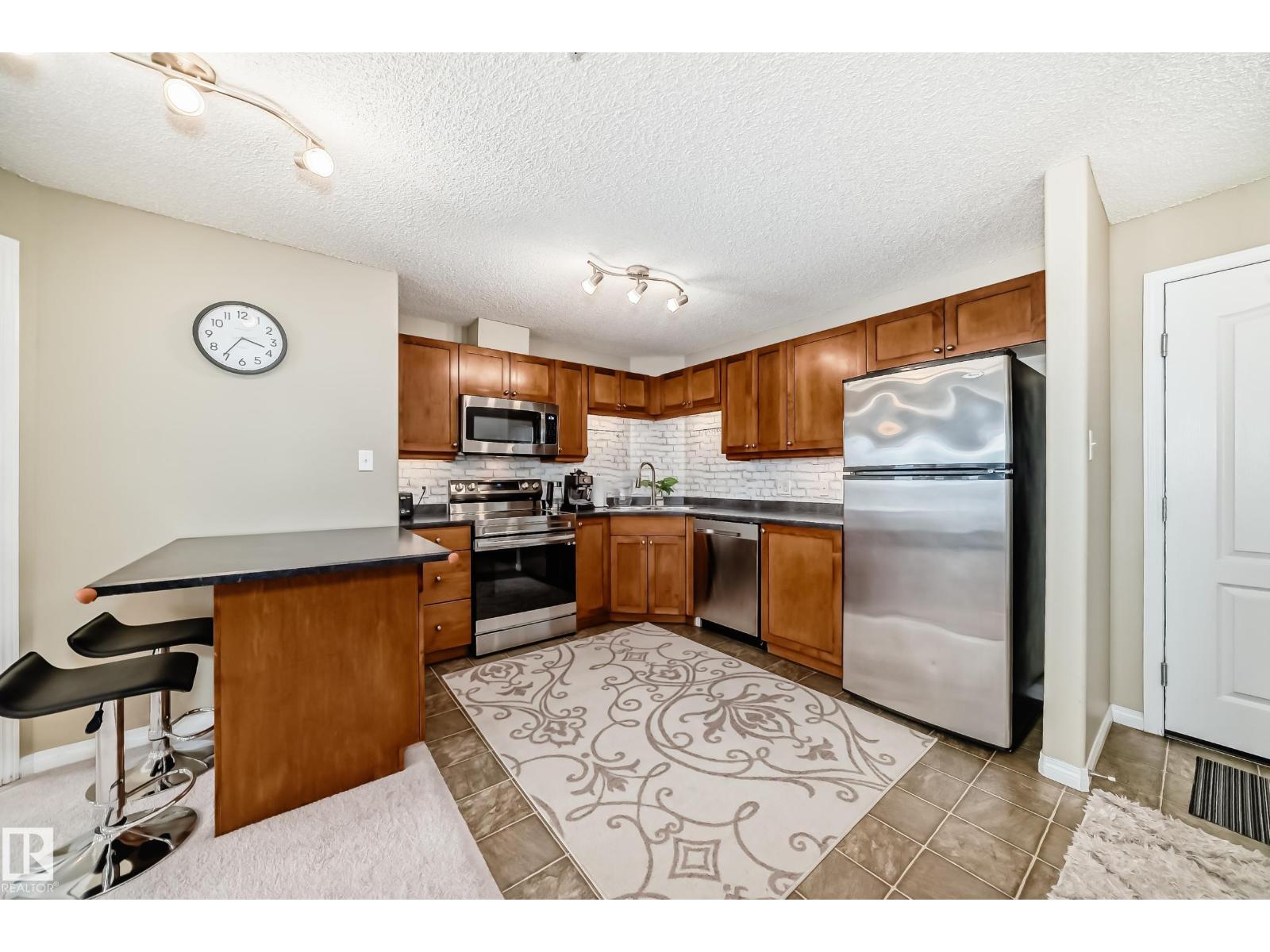 #1309 7339 SOUTH TERWILLEGAR DR NW - 2