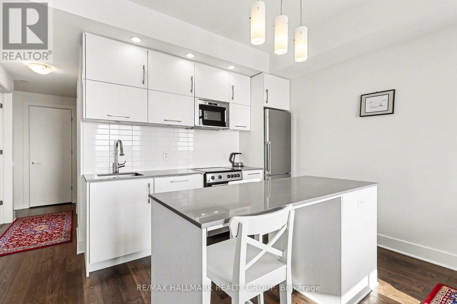 Kitchen with island and stainless steel appliances