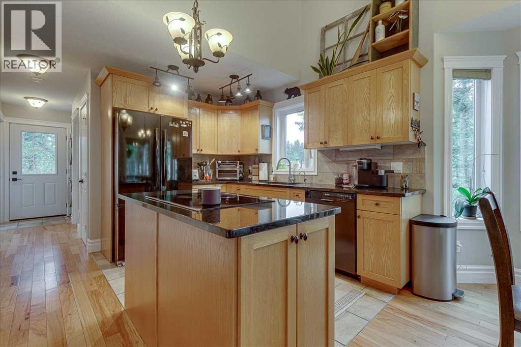 Kitchen W/ Stone Counters & Oak Cabinetry