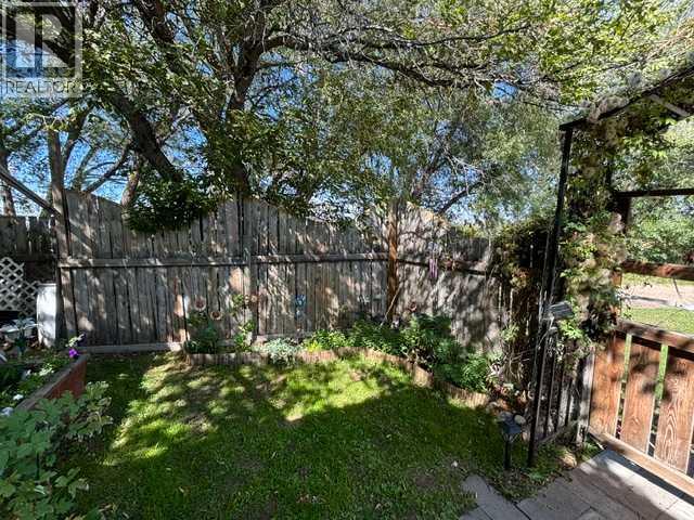 Shaded front yard.  SW viewing NE