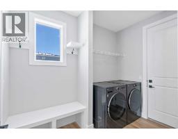 Laundry room - 139 Sundown Crescent, Cochrane, AB T4C1Y3 Photo 12