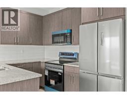 Kitchen - 304 Jumping Pound Common, Cochrane, AB T4C2L1 Photo 12