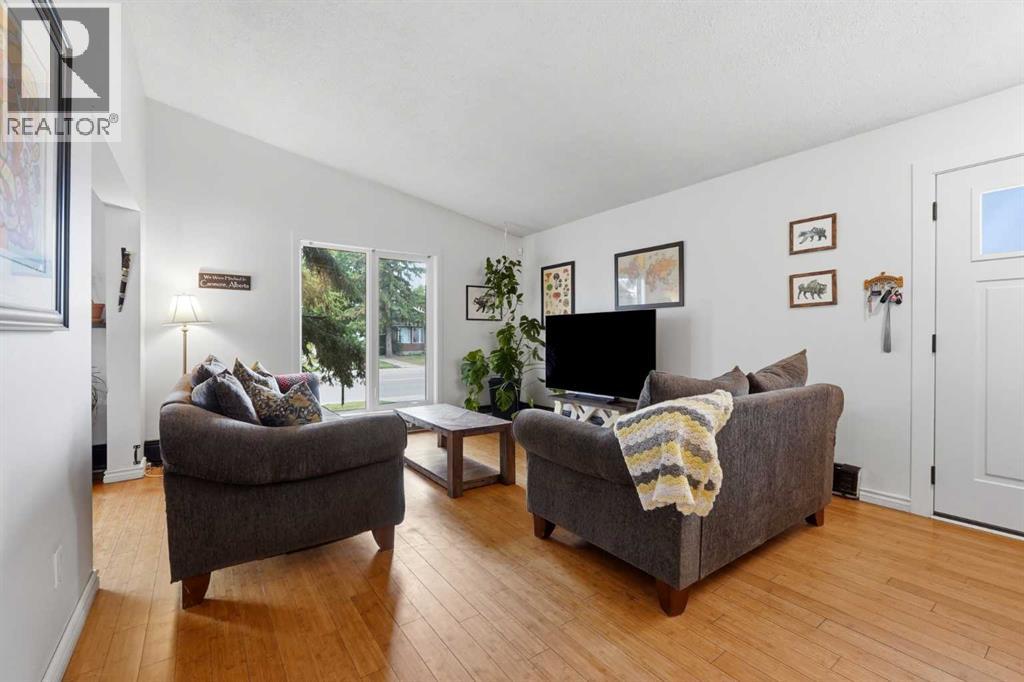 The large front windows that the living room with natural light