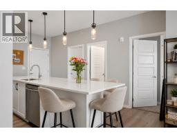 Living room - 411, 4350 Seton Drive Se, Calgary, AB T3M3B1 Photo 6