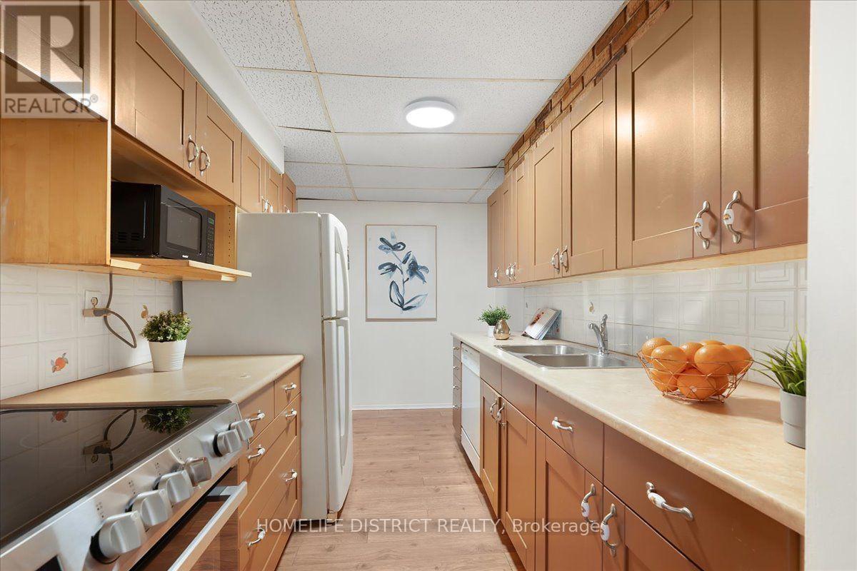 #404 3420 EGLINTON AVENUE E - 12