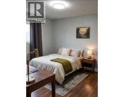 Living room - 1036 Grey Avenue, Crossfield, AB T0M0S0 Photo 13