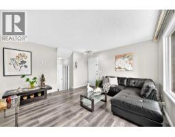 Family room - 33, 175 Manora Place, Calgary, AB T2A4P6 Photo 13