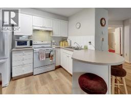 Kitchen - 101, 6800 Hunterview Drive Nw, Calgary, AB T2K6K5 Photo 6