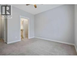 Family room - 22 West Coach Manor Sw, Calgary, AB T3H1R7 Photo 13