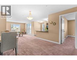 Living room - 7202, 403 Mackenzie Way Sw, Airdrie, AB T4B3V7 Photo 7