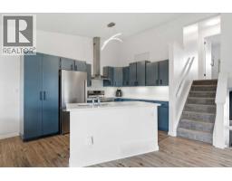 Family room - 48 West Aarsby Road, Cochrane, AB T4C1L3 Photo 10