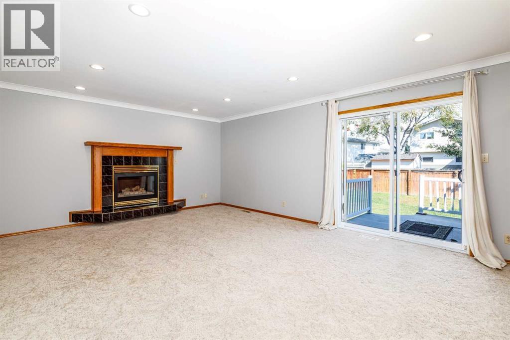 3Rd Level Family Room With Patio Doors And Fireplace