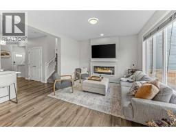 Family room - 65 Morgan Street, Cochrane, AB T4C2R6 Photo 10