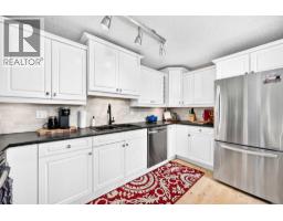 Family room - 6, 64 Woodacres Crescent Sw, Calgary, AB T2W4V6 Photo 7