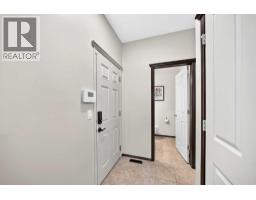 Family room - 27 Pantego Way Nw, Calgary, AB T3K0C3 Photo 19