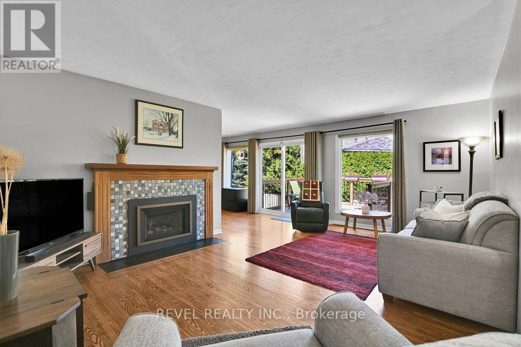 Living room ft. gas fireplace and large windows