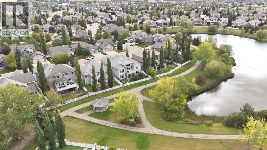View of the green space, lake and walking trails behind the property