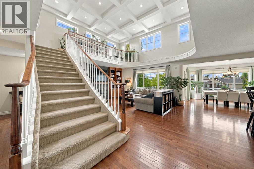Exceptional curb appeal features a stone and stucco exterior, cement roof tiles, stamped concrete driveway and professional landscaping