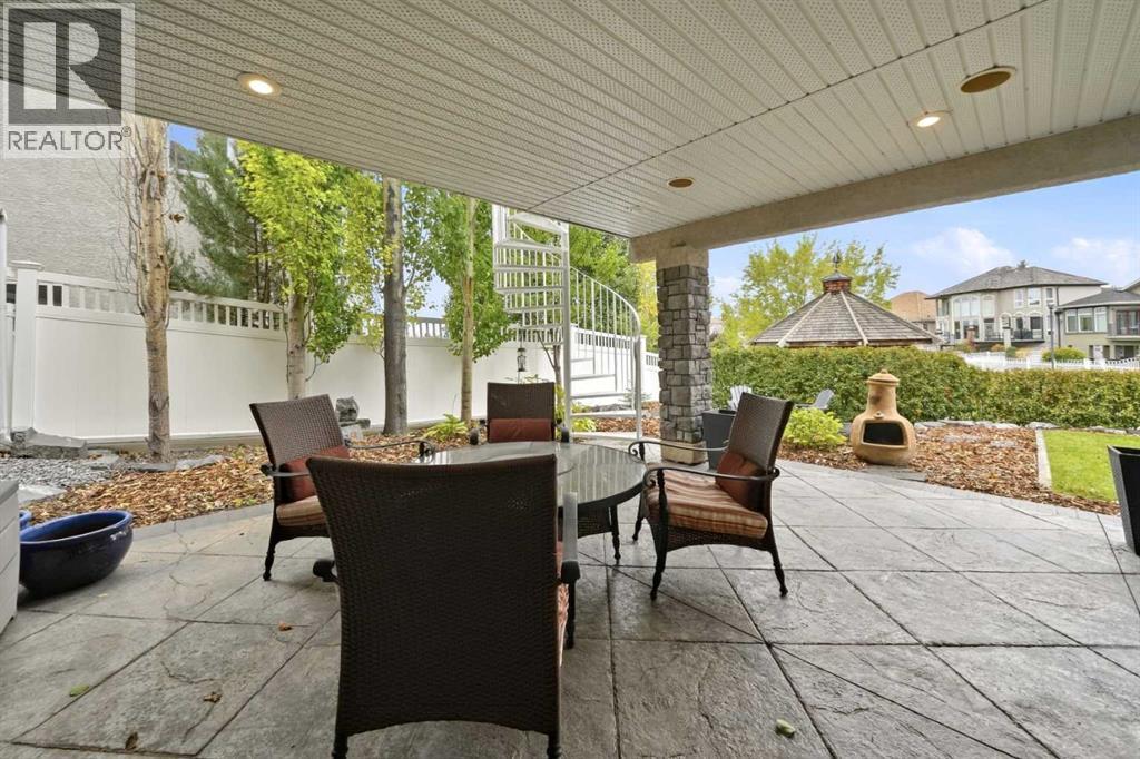Walkout level covered stamped concrete patio