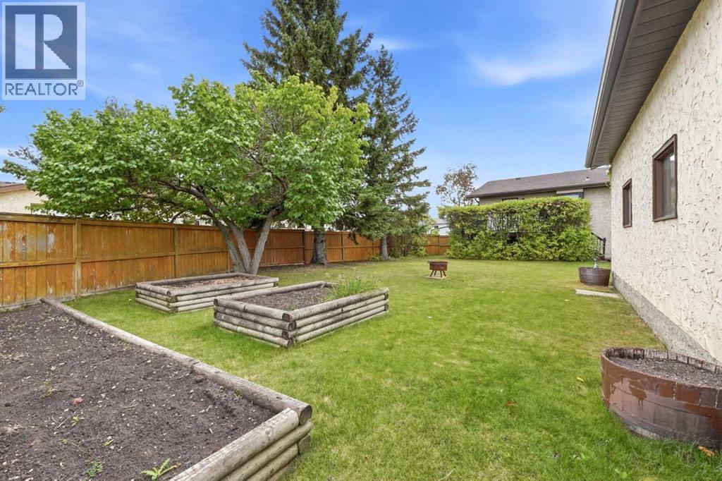 Great curb appeal welcomes you with a stucco exterior, wood trim accents, and a beautiful front crab apple tree