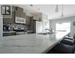 Living room/Dining room - 457 Heritage Drive, Fort Mcmurray, AB T9K1S4 Photo 12