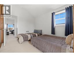 212 Cottageclub Crescent, Rural Rocky View County, AB T2K1B3 Photo 23