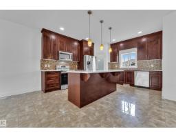 Laundry room - 6454 177a Av Nw, Edmonton, AB T5Y3X2 Photo 7