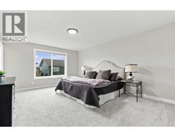 Primary Bedroom - 70 Creekside Avenue Sw, Calgary, AB T2X4A9 Photo 16