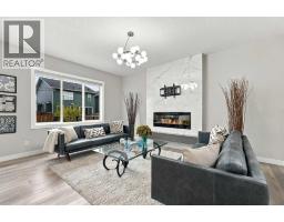 Living room - 70 Creekside Avenue Sw, Calgary, AB T2X4A9 Photo 6