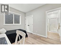 Family room - 70 Creekside Avenue Sw, Calgary, AB T2X4A9 Photo 14