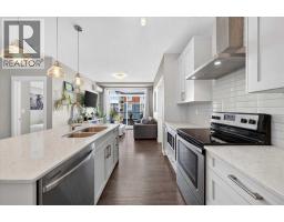 Living room - 310, 10 Walgrove Walk Se, Calgary, AB T2X4E3 Photo 6