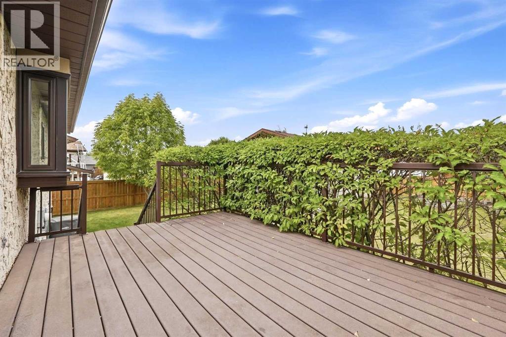 Great curb appeal welcomes you with a stucco exterior, wood trim accents, and a beautiful front crab apple tree