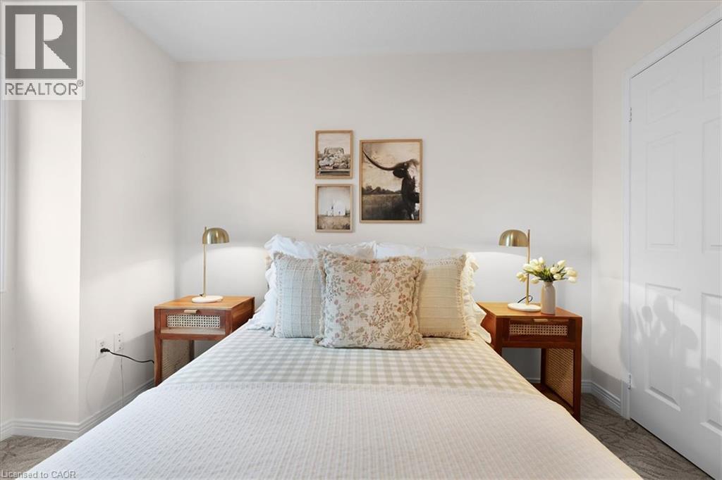 Neutral wall finishes, white trim, paneled interior door, and carpeted flooring