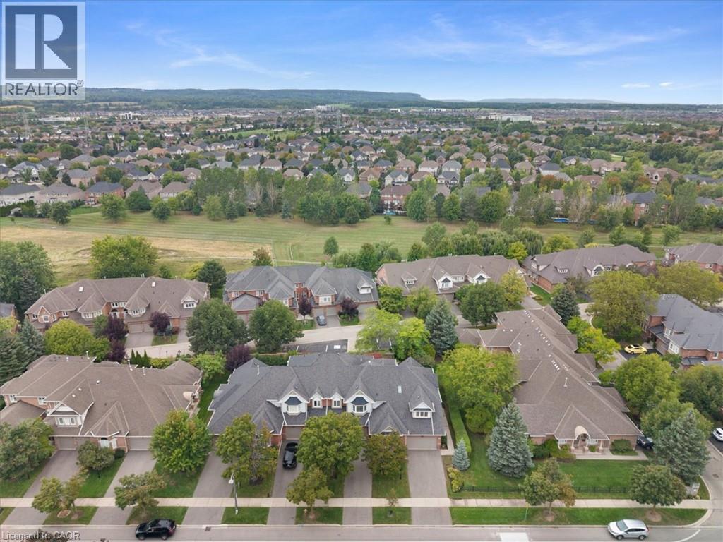 Residential neighborhood with extensive landscaping and mature trees