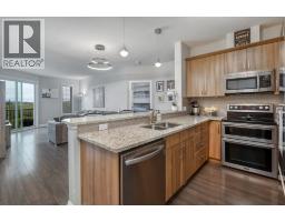 Living room - 2203, 15 Sunset Square, Cochrane, AB T4C0E7 Photo 6
