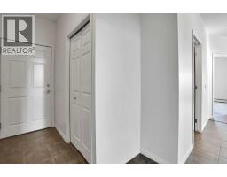 Living room - 214, 5720 2 Street Sw, Calgary, AB T2H3B3 Photo 6
