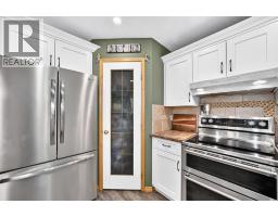 Primary Bedroom - 24 Bow Ridge Road, Cochrane, AB T4C1T7 Photo 16