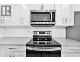 Primary Bedroom - 205, 71 Shawnee Common Sw, Calgary, AB T2Y0R2 Photo 6